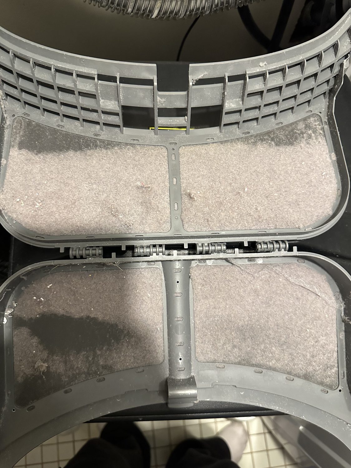 Lint buildup inside a dryer vent line before cleaning